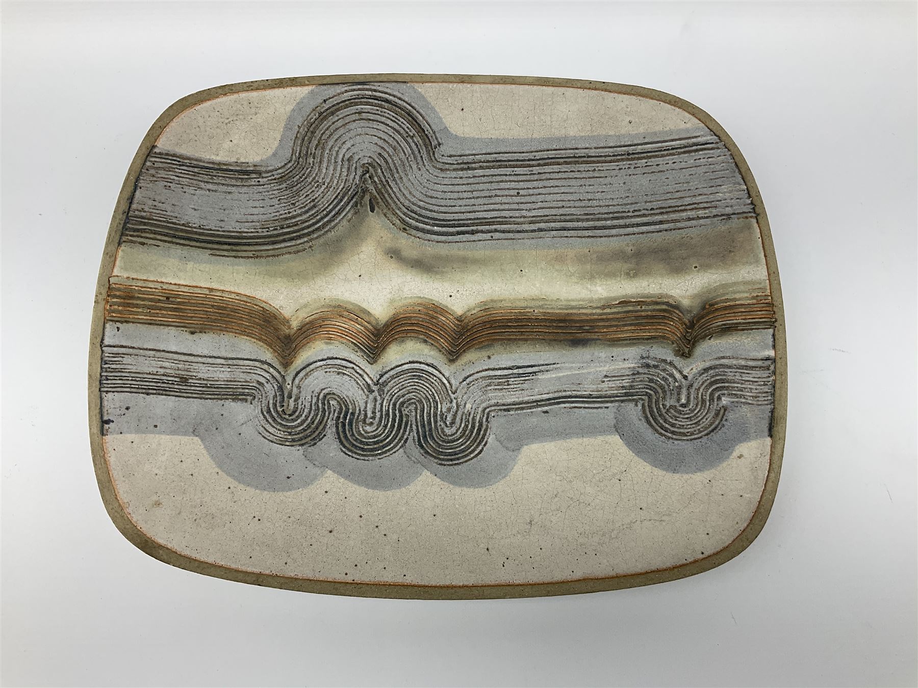 A Keith Hall Llandaff Studio Pottery dish, of oblong form with incised decoration, marked beneath Keith Hall Llandaff, and dated 1971, L35.5cm.