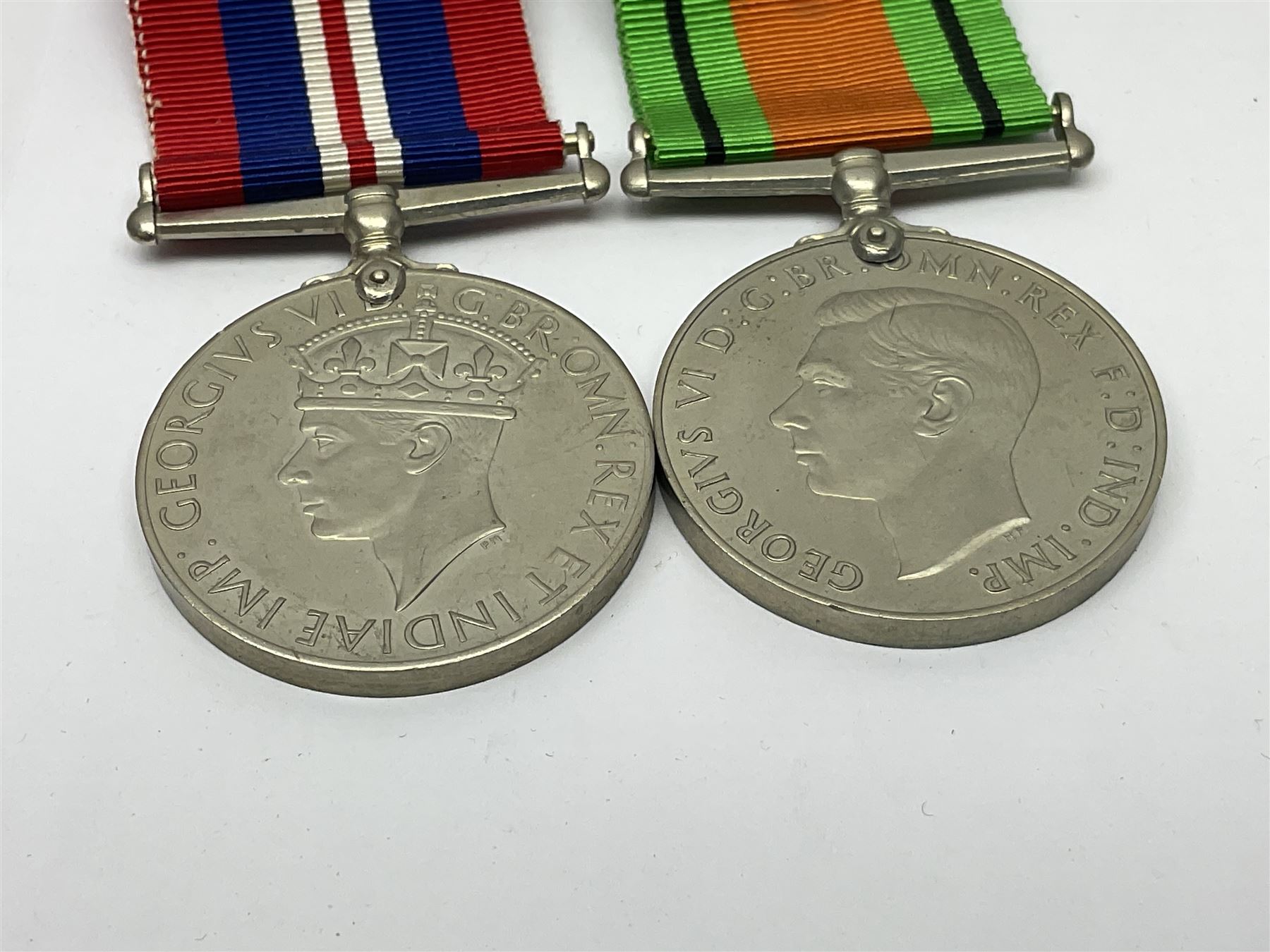 WWI pair of medals comprising British War Medal and Victory Medal awarded to 380807 Pte. W. Hayles Hamps. R.; Imperial Service Medal awarded to William Hayles; cased and boxed; WWII 1939-1945 War Medal and Defence Medal in issue box with slip; 1930s hallmarked silver football presentation fob etc