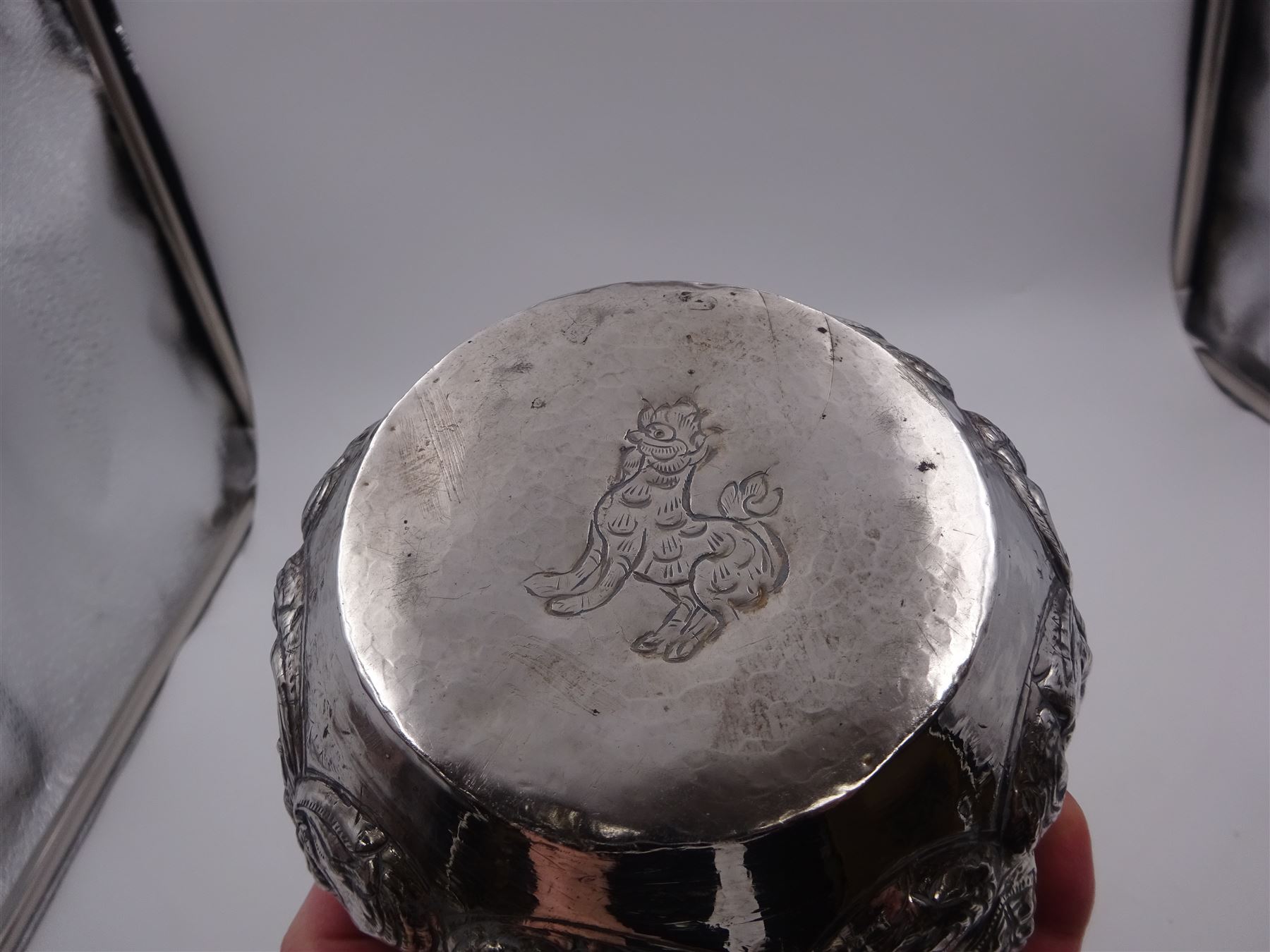 Burmese silver bowl, embossed with figural panels, C scrolls and floral decoration, H8.5cm