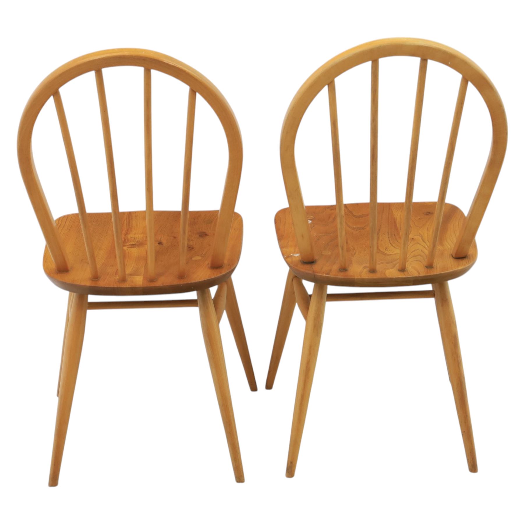 Ercol - set of four 'Windsor' waxed elm chairs, with hoop back design, on tapering supports