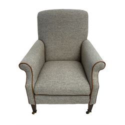 Interiors at Nine to Eleven - Edwardian design armchair, traditional shape with rolled arms, upholstered in 'Harris Tweed' fabric with leather piping, raised on square taping supports with castors