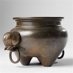 Chinese bronze tripod censer, of squat globular form, the body decorated with a band of Greek key motifs, the twin handles formed as two elephants heads, with incised shi shou two-character mark to base, H10cm