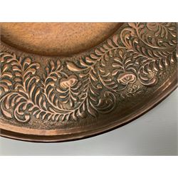 Arts and Crafts Keswick School of Industrial Arts copper charger, decorated with planished centre and repousse scrolling foliate tendrils to rim, D44cm