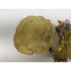 Victorian large wax over composition Pumpkin head doll, with inset dark glass eyes, moulded blonde hair in curls, stuffed body with carved and painted wooden limbs, grey painted boots, floral satin dress with netting underclothes H61cm