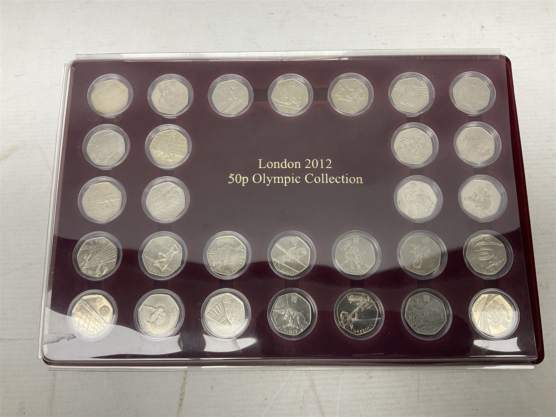 Queen Elizabeth II United Kingdom London 2012 Olympic commemorative fifty pence collection comprising twenty-nine coins, housed in unofficial display case