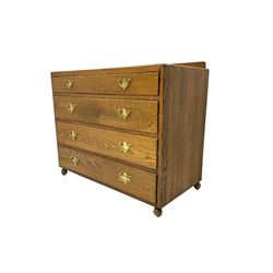 Mid-20th century oak chest, raised back, fitted with four graduating drawers, on castors