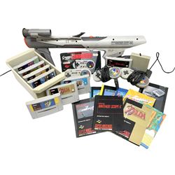 Two Super Nintendo Entertainment System (PAL) controllers, accessories and games. Super NES Game Commander with original box and instruction booklet, Super NES Nintendo Scope (1992) transmitter gun, receiver, Super NES Nintendo Scope 6 game with original instruction booklets. Further games to include ‘The Legend of Zelda a Link to the Past’, ‘Super Mario World’, ‘Super Mario Kart’, ‘The Lawnmower Man’, and ‘Exhaust Heat’, all with original instruction booklets. ‘PowerMonger’ and Disney’s ‘Aladdin’ game cartridges only 