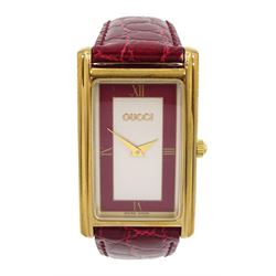 Gucci gold-plated rectangular quartz wristwatch, Ref. 2600M, red and silvered dial, on original red leather strap, boxed