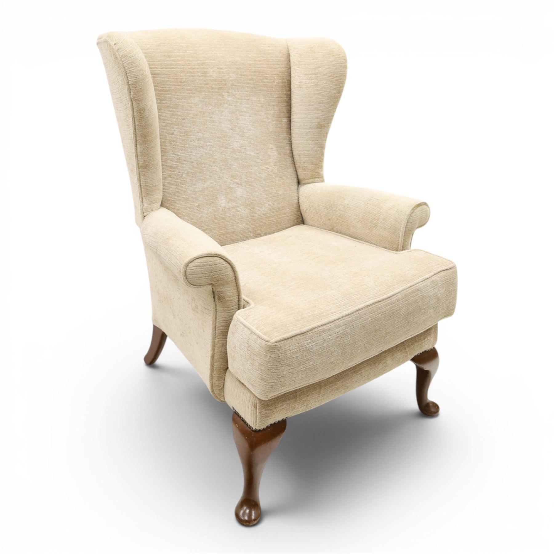 Parker Knoll - 'Hartley' lounge suite, comprising three wingback armchairs and two-seat settee, upholstered in cream fabric, shaped wing backs with scroll-over arms and loose seat cushions, on cabriole supports with pad feet wingbacks and settee

Armchairs: H 96cm, D 83cm, W 75cm