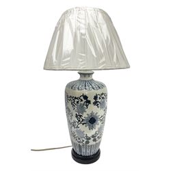 Table lamp of tapering form, decorated with stylised flowers, upon a footed circular base, with shade H70cm