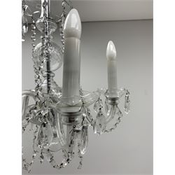 A glass chandelier, with five curved branches with drip pans and droppers, approximately H69cm. 