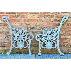 Pair of Nistercian pattern cast iron bench ends, each with cartouche inscribed 