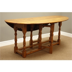  18th century style light oak wake table, oval drop leaf top, on gate leg action base with turned supports, W183cm x D105cm, H76cm  