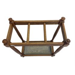 Mid-20th century oak umbrella stick stand,  three division, with metal drip tray, on turned supports