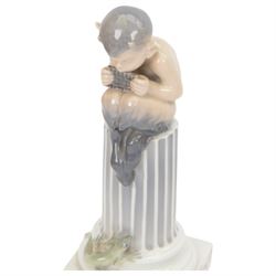 Two Royal Copenhagen figurines of fawns, comprising a fawn with an owl, no 2107 and fawn on plinth no 433, together with Bing & Grondahl, figure of a parrot on branch