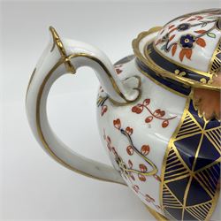 Early 20th century Royal Crown Derby teapot, decorated in a variant of the Imari pattern with blue and red prunus blossoms, with printed mark beneath including illustration date code for 1927, H14cm
