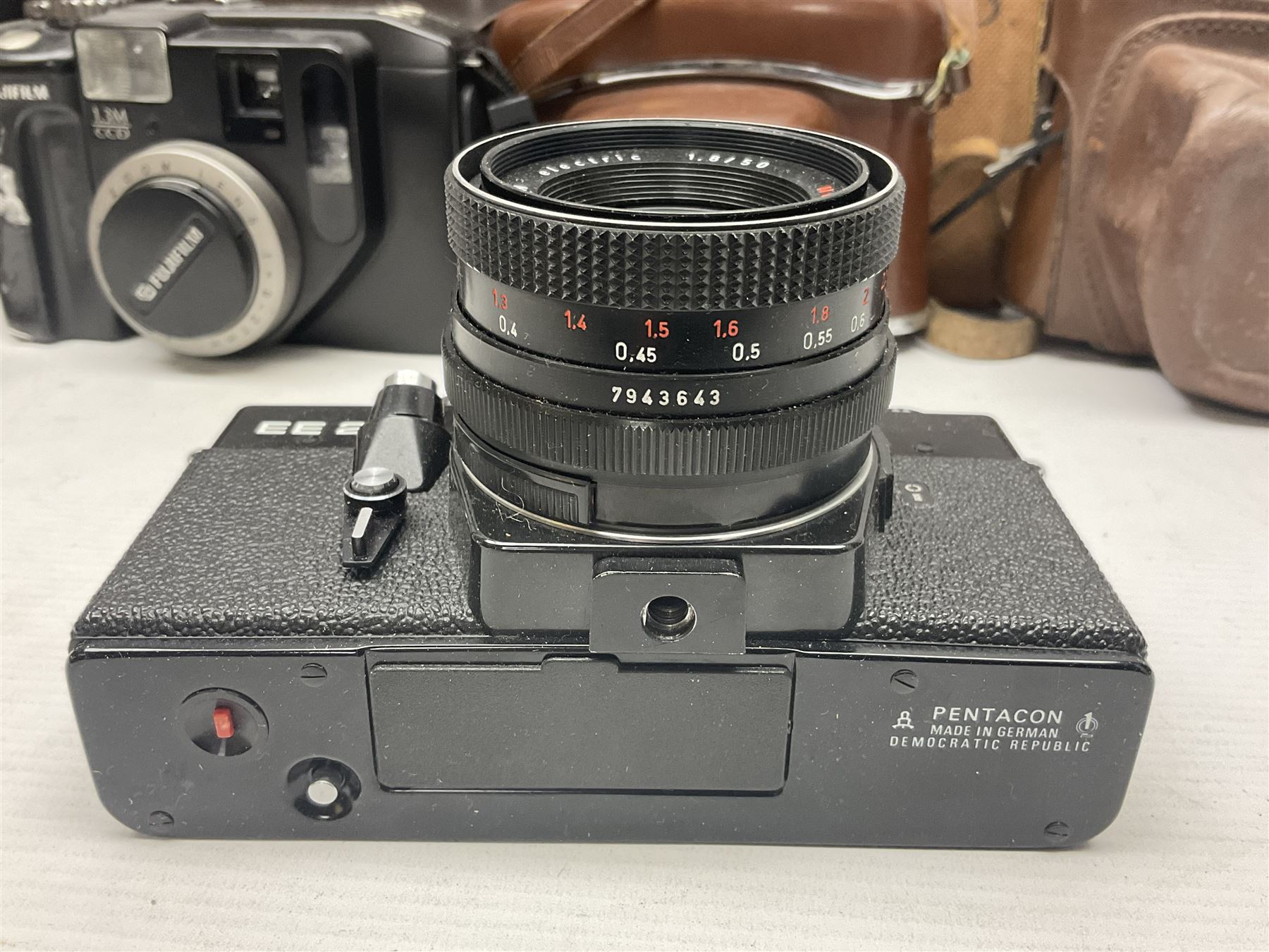 Collection of cameras and lenses, to include Pentax Program A camera body, serial no 123759, with 'Pentax-A zoom 1:3.5-4.5 28-80mm' len, Praktica EE2 camera body with 'Pentacon electric 1.8/50' lens etc, together with a Manfrotto tripod 