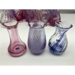 Collection of pink/purple Caithness glass vases, to include mottled and swirl designs, largest 20cm (19)