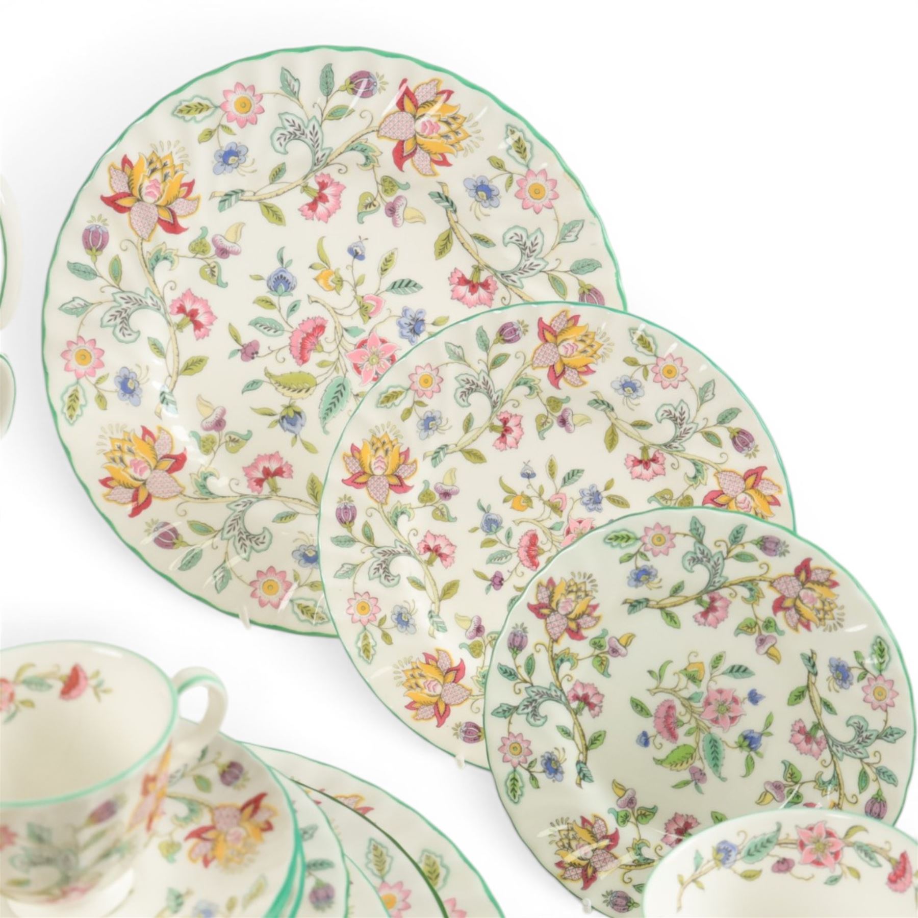 Minton Haddon Hall tea and dinner service, including teapot, milk jug, hot water jug, open sucrier, ten teacups and eight saucers, eight dinner plates, eight soup bowls, etc 