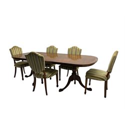 Regency design walnut twin pedestal extending dining table, rectangular burr top with rounded corners and crossbanding, raised on turned vasiform columns with tripod base, with additional leaf (D107cm W184cm/230cm, H76cm); and set eight (6+2) shield back dining chairs, upholstered in striped laurel green fabric, raised on tapering supports with spade feet, retailed by Geoffrey Benson