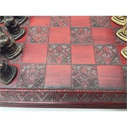 Alice in Wonderland themed chess set, with a complete set of composite figures, modelled as characters including Alice, Tweedledum and Tweedledee, the White Rabbit and the Mad Hatter, etc