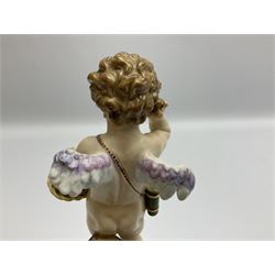 Late 19th/early 20th century Meissen figure of cupid, modelled standing with empty quiver across back, holding a basket in one arm, the other raised to head, upon a naturalistically modelled base detailed with gilt bow,  and marble effect socle base with gilt bands, with blue crossed swords mark beneath, H18.5cm