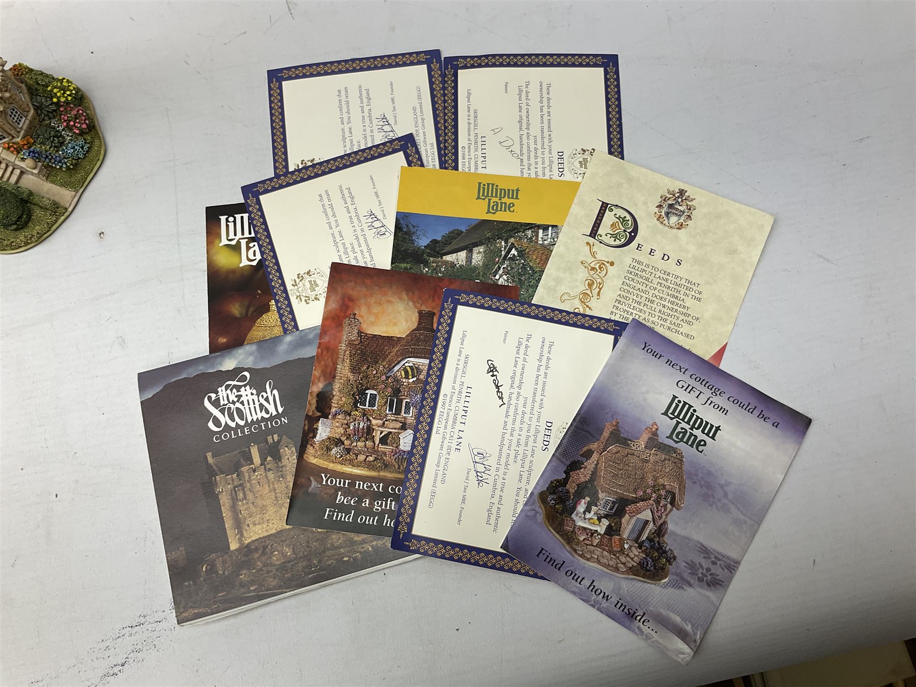 Eleven Lilliput Lane cottages from the British / English Collection, to include Tudor Court, Swan Inn, Culross House etc all boxed with deeds