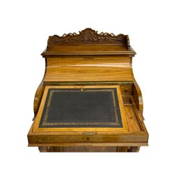 Fine and unusual 19th century olivewood piano top davenport, raised shaped back carved with olive branches and olives, the top hinges to reveal lidded and correspondence compartments, the piano lid enclosing sliding top with hinged and adjustable writing surface with leather inset, right-hand panelled door enclosing four drawers, olive branch and scroll carved cabriole front supports on moulded and shaped platform, turned cup feet with recessed castors 