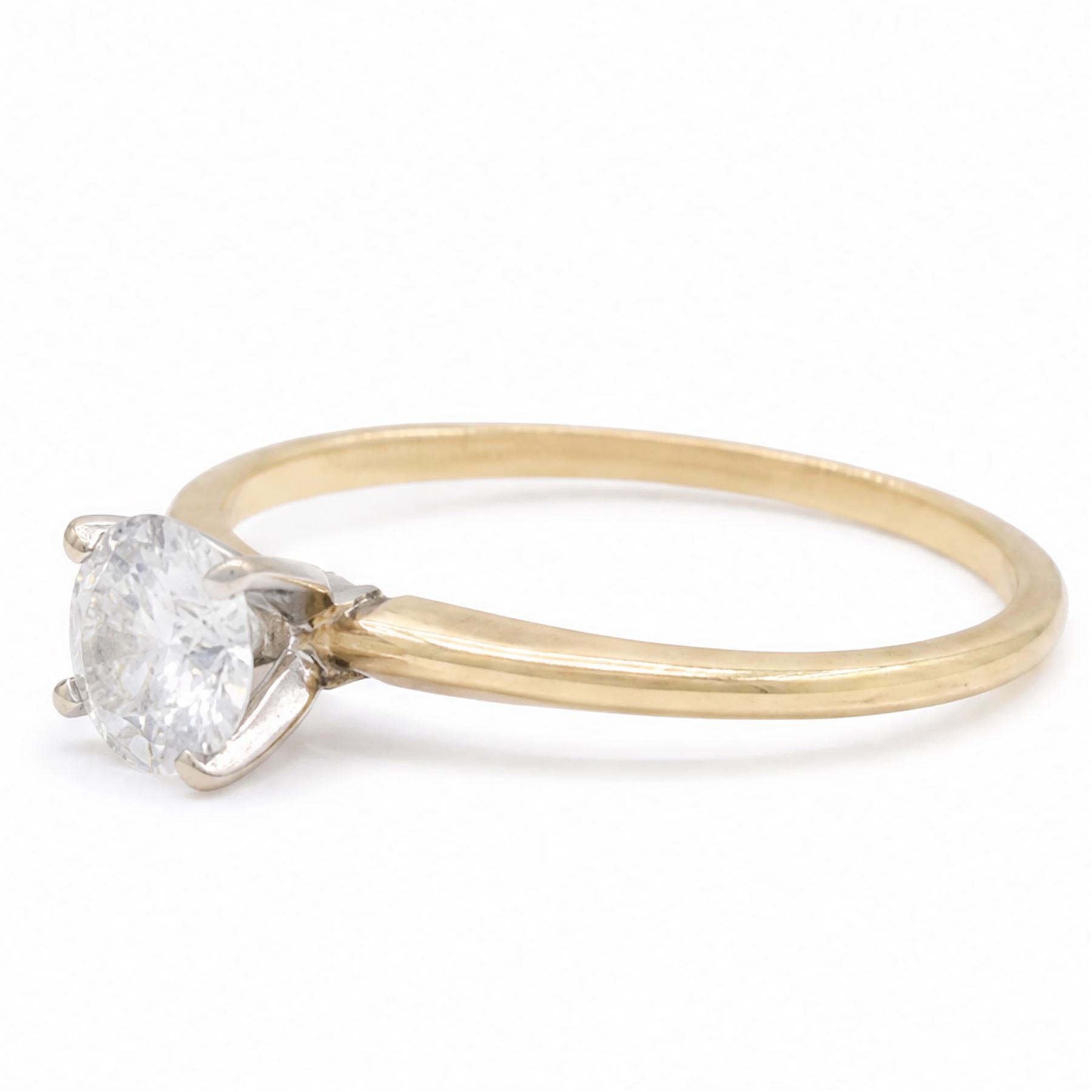 14ct gold diamond ring, four claw set with a single round brilliant cut diamond of 0.61 carat, stamped