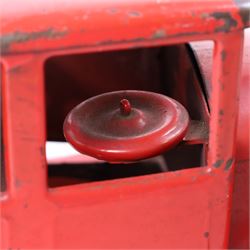 Tri-ang/Line Bros Ltd tin plate tipper truck, red body with black rubber wheels and red seat and steering wheel to interior, H49cm, L16cm