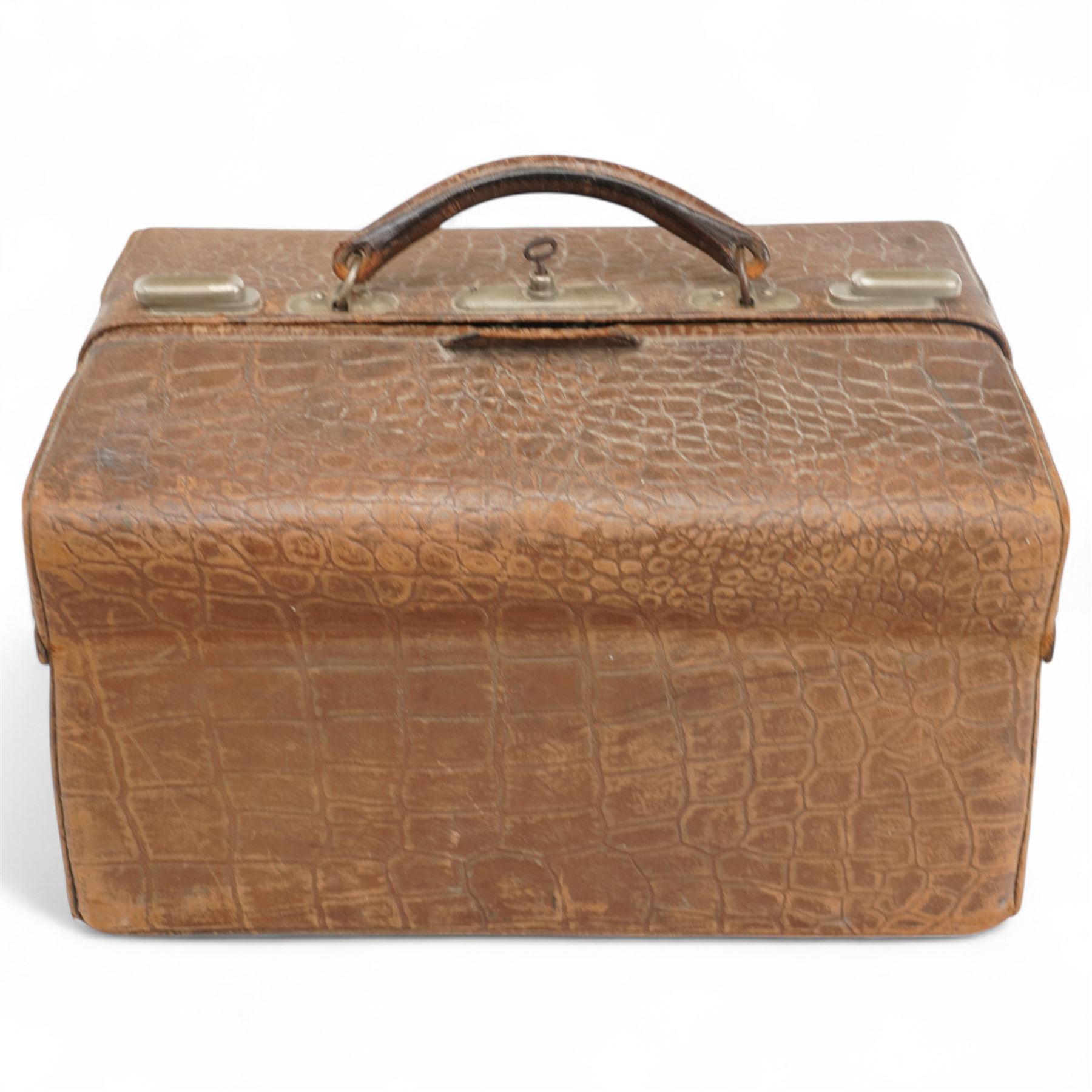 Ladies Edwardian crocodile travelling toilet case with watered silk interior containing six silver mounted glass jars Birmingham 1909 Maker Neal Bros. and a three piece dressing table set Sheffield 1898 W35cm