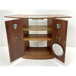 Mid 20th century teak cocktail bar, hinged top above two cupboard doors enclosing fitted interior, two sliding glazed doors to rear