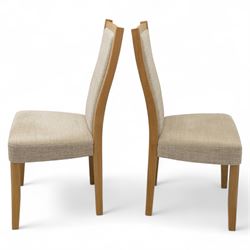 Ercol - light oak ‘Artisan’ rectangular dining table with chamfered top extending fold over top and tapered legs, together with two matching high back dining chairs upholstered in textured beige fabric (Chairs H 98cm, W 47cm, D 52cm)