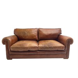 Large two seat sofa upholstered in tan 'Derwent' leather (W200cm D100cm H85cm), and matching armchair (W95cm)
