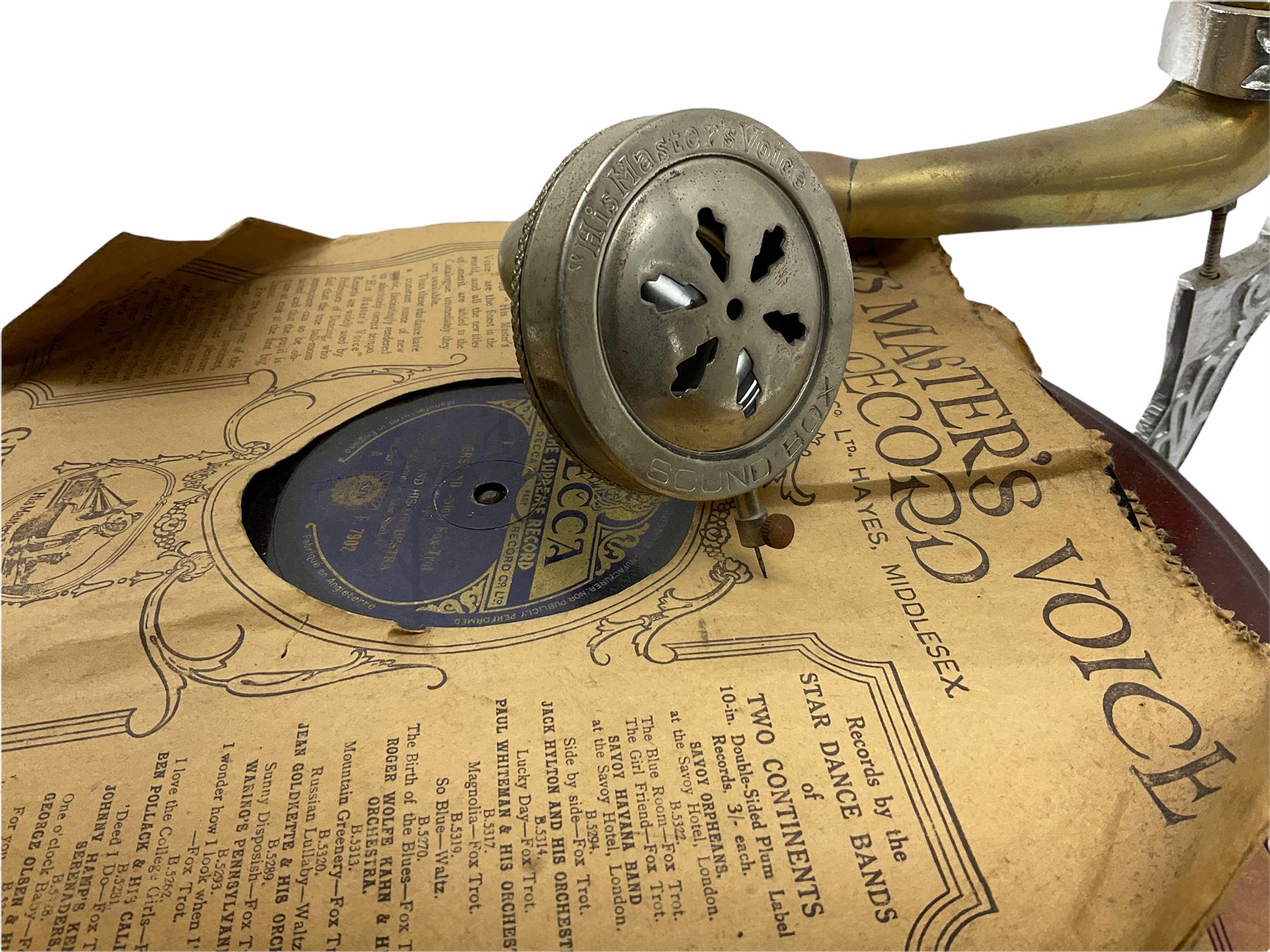 His Master's Voice table top wind up gramophone on a circular wooden base, with brass horn, H72cm, Horn D43cm. 