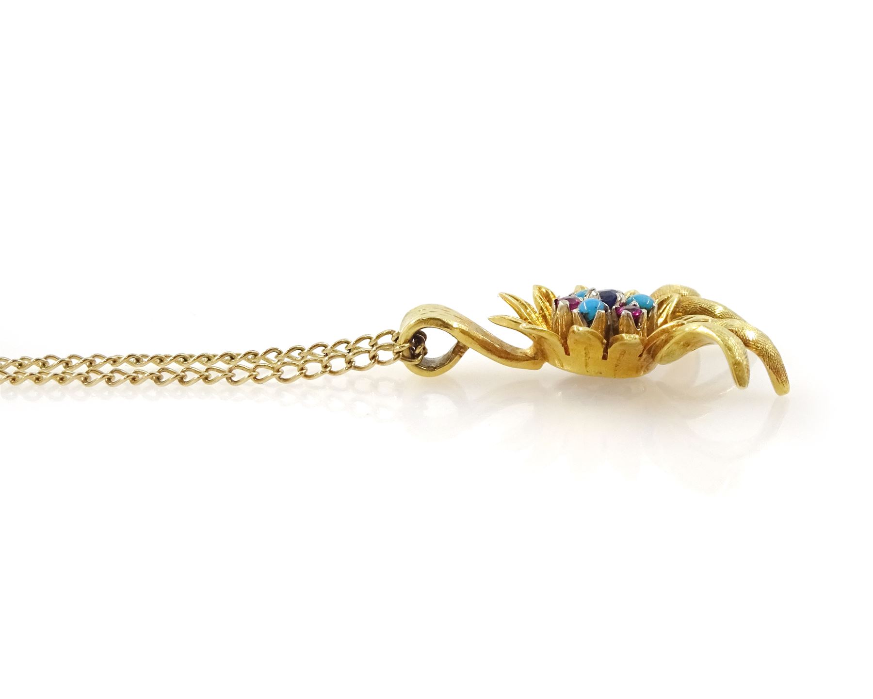 18ct gold ruby, sapphire and turquoise flower head pendant, set with single sapphire, surrounded by six alternate rubies and turquoise stones, on a 9ct gold fine curb link chain necklace, hallmarked