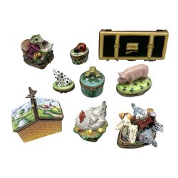 Group of Limoges trinket boxes, to include a number of novelty examples, including examples modelled as Noah's ark, shotgun case containing shotguns, picnic basket containing food, toad reading book seated upon a lily pad, etc., (9)