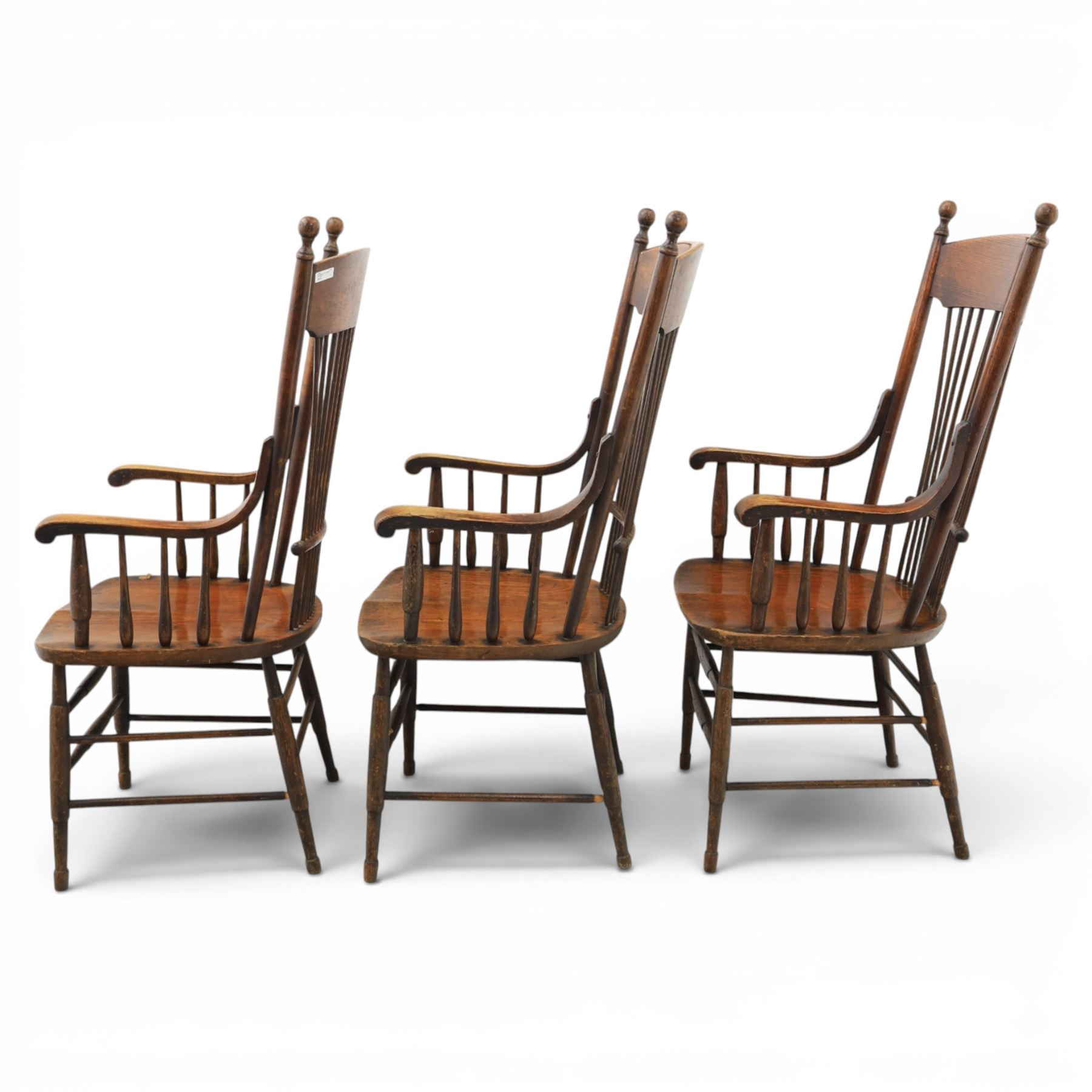 Set of three 19th century ash and elm spindle back Windsor armchairs, arched top rails above fan-shaped spindle backs, curved arms with turned supports, shaped saddle seats, on turned legs joined by H-stretchers