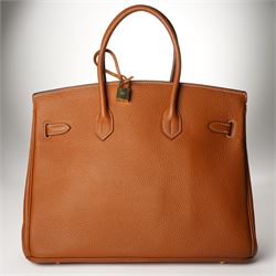 Hermès - gold hardware 'Birkin 35' handbag in gold Togo leather with white stitching, featuring gold-plated hardware, double rolled handles, front flap, belted turn-lock closure, and leather lining with one zip and one slip pocket, stamped 'Hermes Paris Made in France' in gold, with blind-stamp Q (2013) with craftsman’s code 70A to the underside of locking belt. Accompanied by: padlock, keys, clochette, Hermes dust bag, booklet, and ribbon. New unused condition.