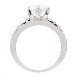 Platinum single stone round brilliant cut diamond ring, with diamond set shoulders and diamond set gallery, principal diamond approx 1.00 carat