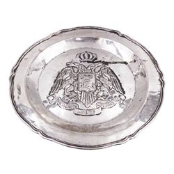 Spanish colonial silver salver, probably Peruvian, of circular form with shaped rim, embossed to centre with the coat of arms of Lima, depicting a two headed eagle sable, with crown above, with central shield initials K J, D27cm