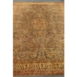  Large Persian design carpet, field decorated with swirled foliage, central medallion, repeating guarded border, 407cm x 318cm  