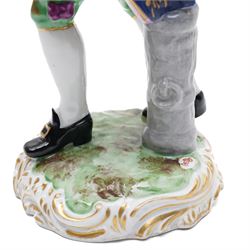 Pair of 19th century Samson of Paris figures of male and female itinerant milliners, each holding a basket with ribbons and flowers on rococo style gilt bases H33cm