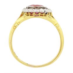 Early 20th century gold tourmaline and diamond cluster ring, milgrain set single stone pink tourmaline of approx 1.35 carat, surrounded by sixteen old cut diamonds, to a split design scroll shank, stamped 18ct, total diamond weight approx 0.30 carat
