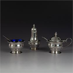1930s silver three piece cruet set, comprising pepper shaker, open salt and mustard pot an...