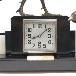 French- Early 20th century Art Deco mantel clock with an 8-day timepiece movement, on a polished rectangular slate base, with inset cream onyx panels, surmounted by a pair of highly decorative bronze effect pheasants, square 4