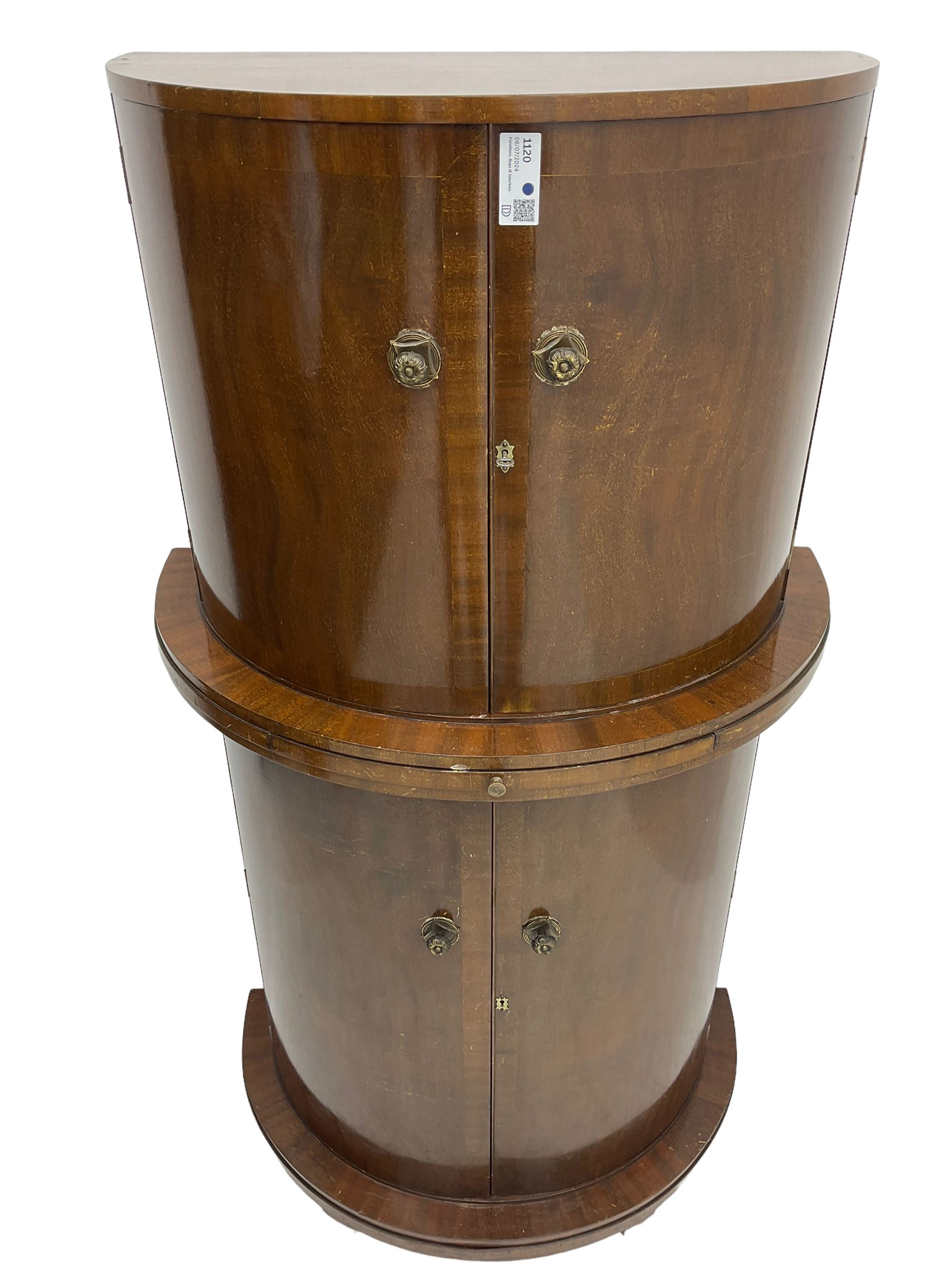 1930s Art Deco walnut demi-lune cocktail cabinet, enclosed by four curved doors, the upper section with mirrored interior, glass shelf and glass holders, the lower section fitted with shelves and bottle holders