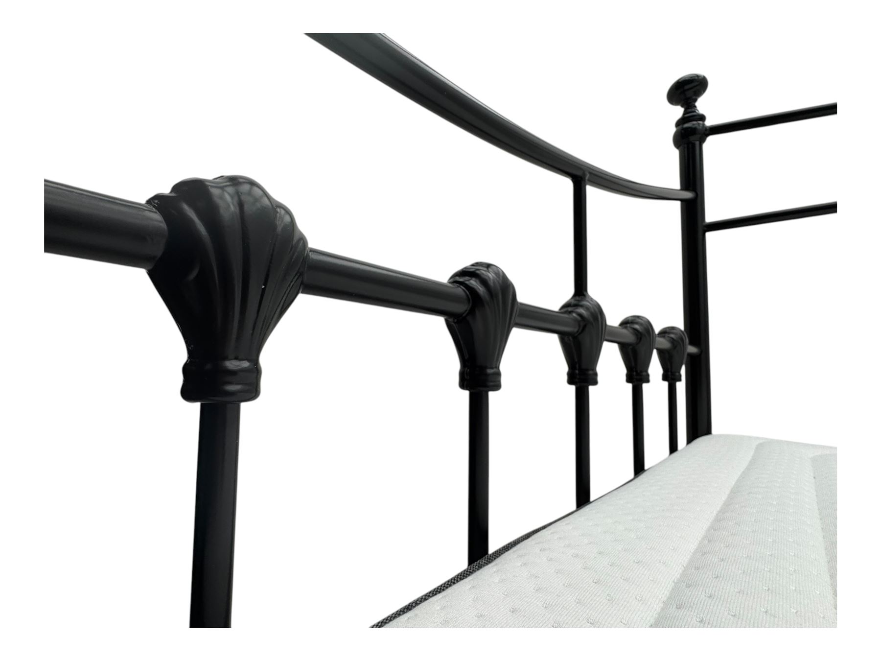 Contemporary Victorian revival black metal day bed, featuring arched back and sides with turned finials and spindle rails, complete with single 'OTTO' mattress