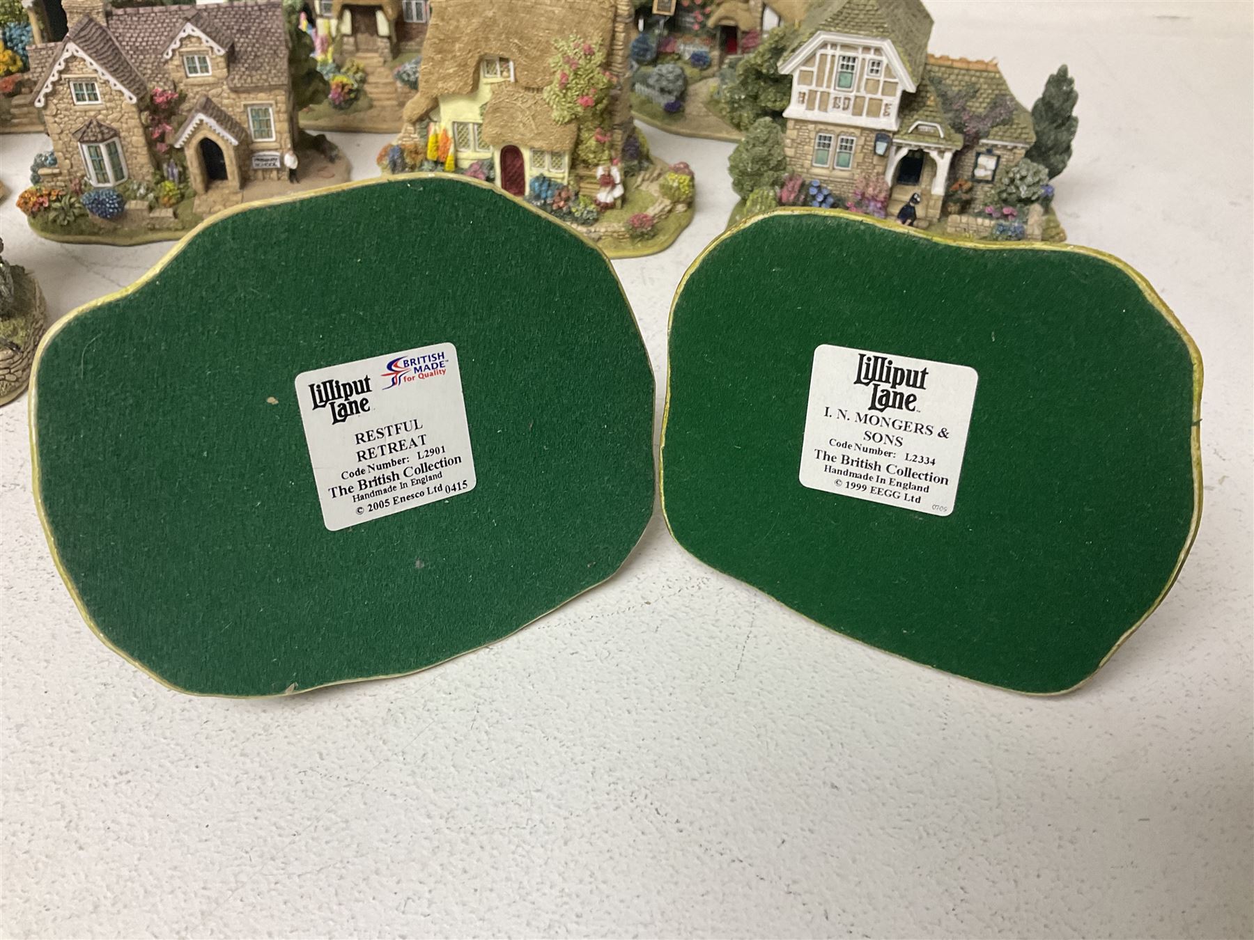 Fifteen Lilliput Lane models, including The Nineteenth Hole, Cowslip Cottage, The Lion Mongers, Going For a Song and Old Crofty, Gossip Gate and Beehive Cottage, all with deeds and original boxes (15)