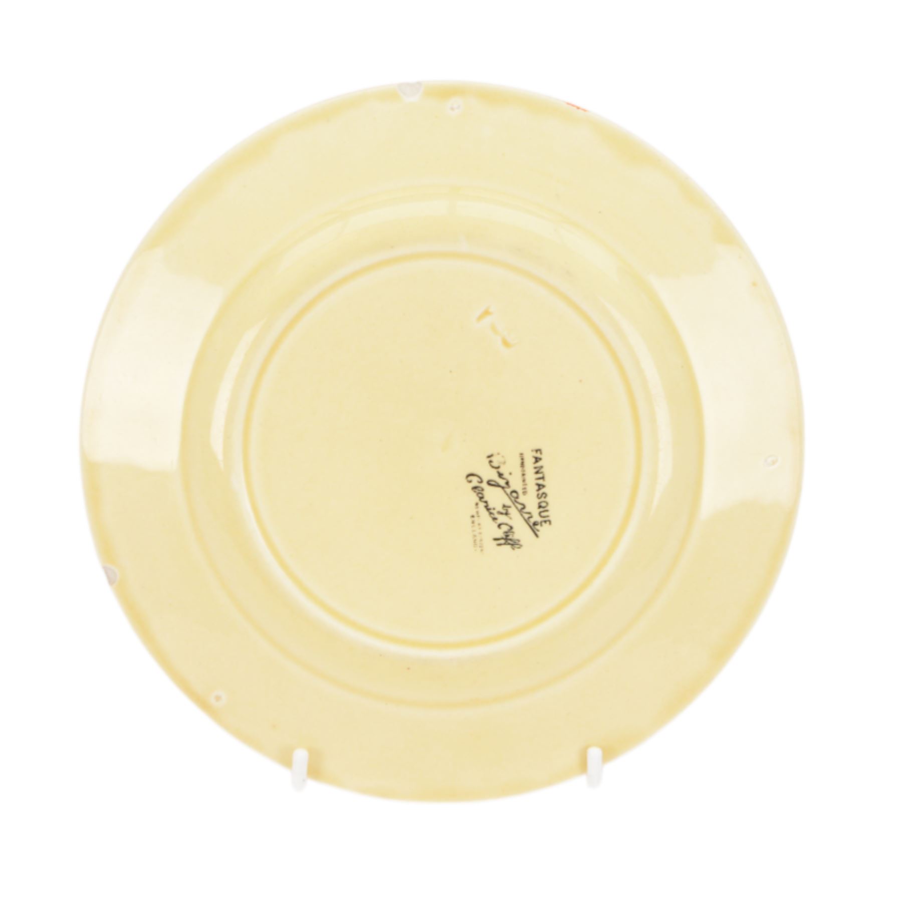 Clarice Cliff Orange Trees & House pattern side plate circa 1931, hand painted with a stylised tree and cottage landscape with orange and black banding, with printed mark beneath, together with a Clarice Cliff Spring Crocus pattern side plate, with printed mark beneath, largest D20cm  